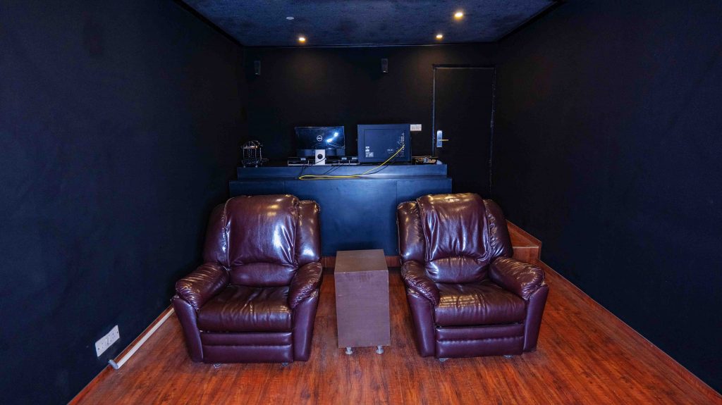 color grading suite with recliners for comfort for clients at swastika films, new delhi, india