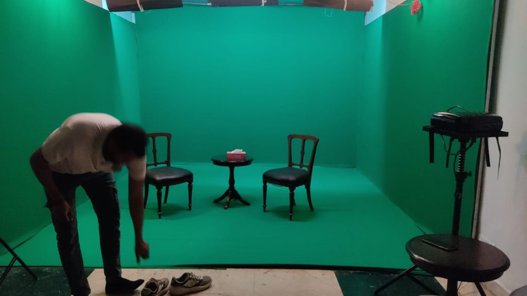 green screen chroma studio with furniture & lights. for interview shoots